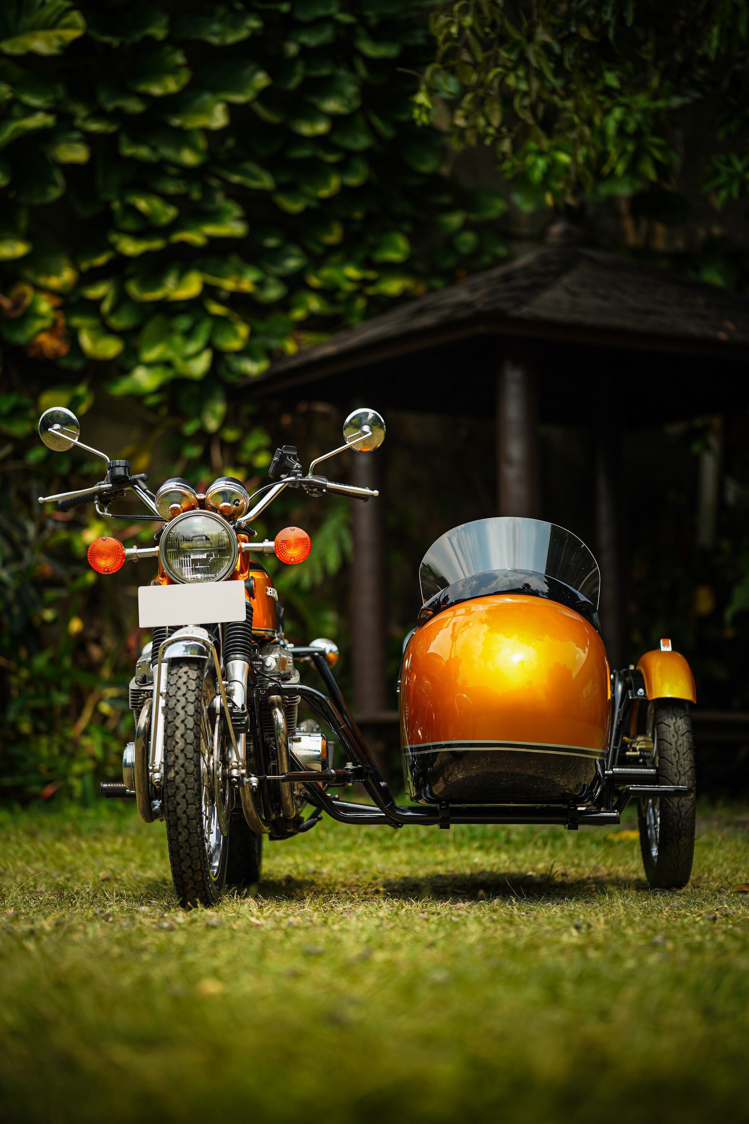 vintage scooter with custom paint parked on small street – Scooter99